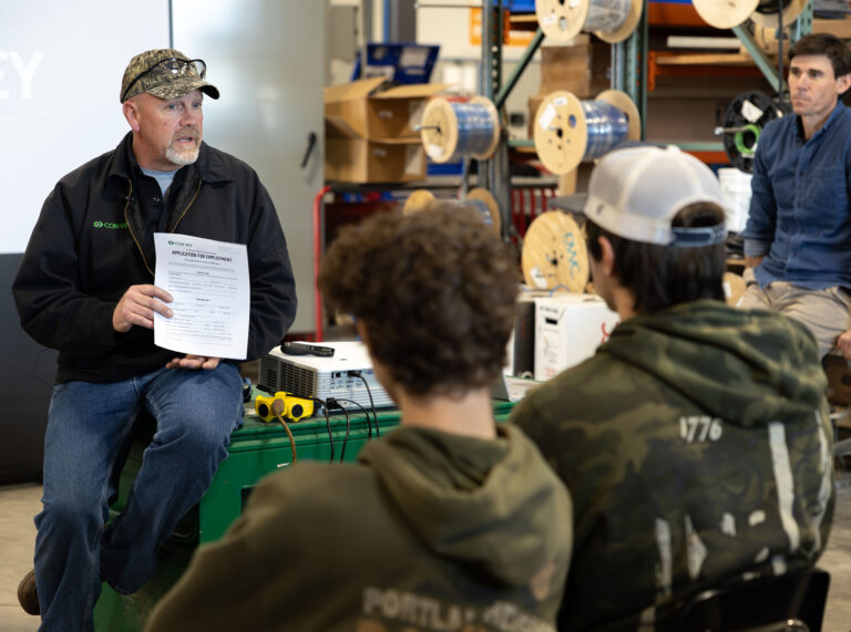 A Con-Vey leader speaks with young members of the Roseburg community