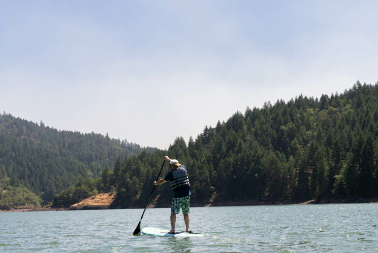 A paddle boarder on a lake near Roseburg