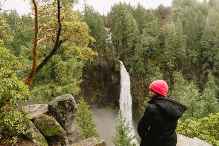A hiker overlooks a scenic waterfall near Roseburg